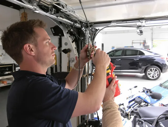 Longmeadow Garage Door Repair safety certified technician performing cable replacement in Longmeadow