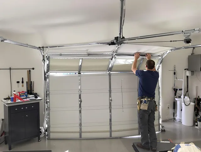 Longmeadow Garage Door Repair specialist performing precise section replacement on Longmeadow garage door