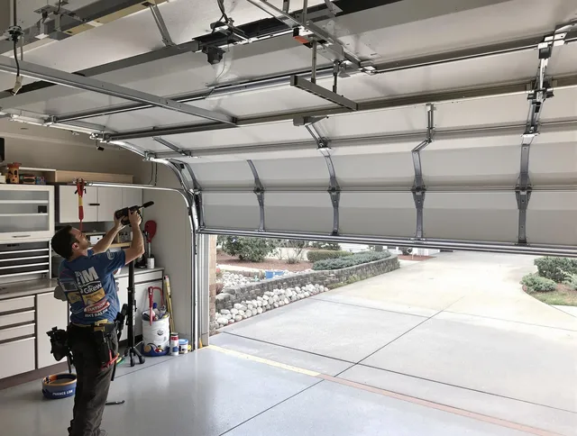 Garage door track repair service by Longmeadow Garage Door Repair in Longmeadow